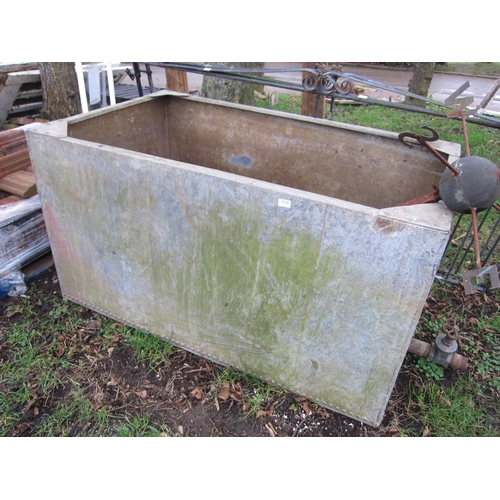 7101 - A riveted galvanised tank with tap, 150cm x 87cm x 80cm