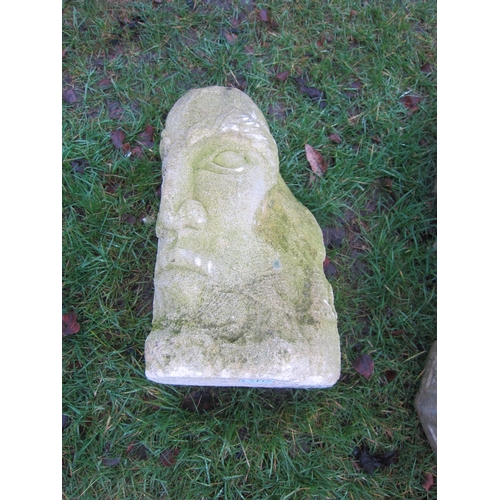 7117 - A carved stone face, 43cm tall