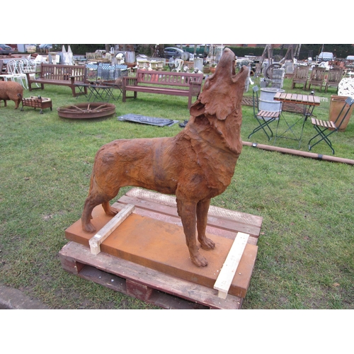 7455 - A cast iron howling Wolf, 127cm tall