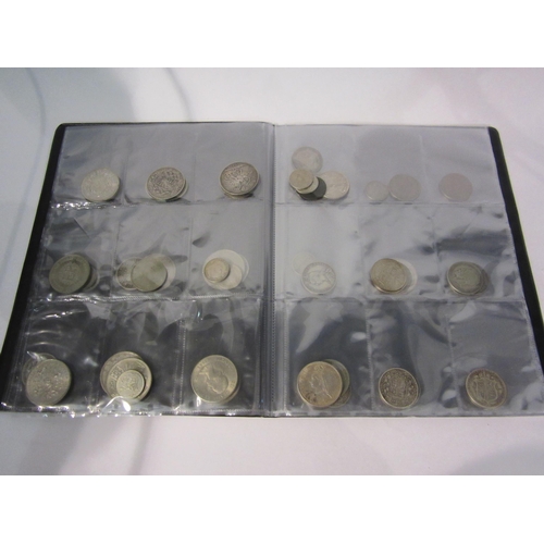 4290 - A folder of British pre decimal silver and cupro nickel coinage from George III to Elizabeth II