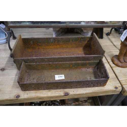 2061 - Two cast iron feed troughs