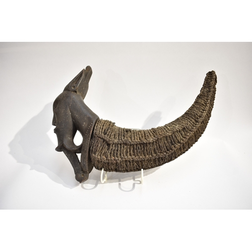 8619 - A Batak medicine horn Sumatra, Indonesia.  The horn body is rope bound with a carved wood Batak sing... 