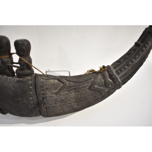 8621 - A Batak medicine horn Sumatra Indonesia.  The back horn body decorated with lizard and the end carve... 