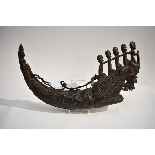 8622 - A Batak medicine horn Sumatra Indonesia.  The black polished horn body carved with Lizard and serpen... 