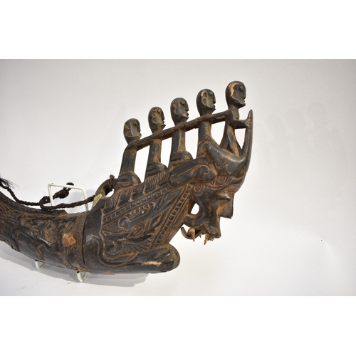 8622 - A Batak medicine horn Sumatra Indonesia.  The black polished horn body carved with Lizard and serpen... 