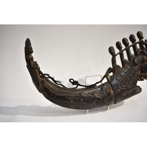 8622 - A Batak medicine horn Sumatra Indonesia.  The black polished horn body carved with Lizard and serpen... 