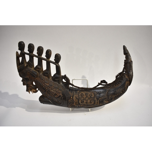 8622 - A Batak medicine horn Sumatra Indonesia.  The black polished horn body carved with Lizard and serpen... 