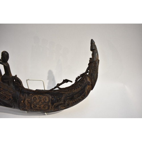 8622 - A Batak medicine horn Sumatra Indonesia.  The black polished horn body carved with Lizard and serpen... 