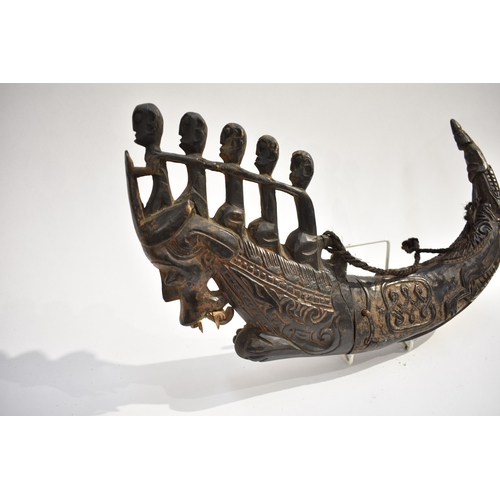 8622 - A Batak medicine horn Sumatra Indonesia.  The black polished horn body carved with Lizard and serpen... 