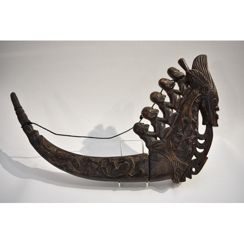 8623 - A Batak medicine horn Sumatra Indonesia.  The polished carved black horn carved with a dragon, lizar... 