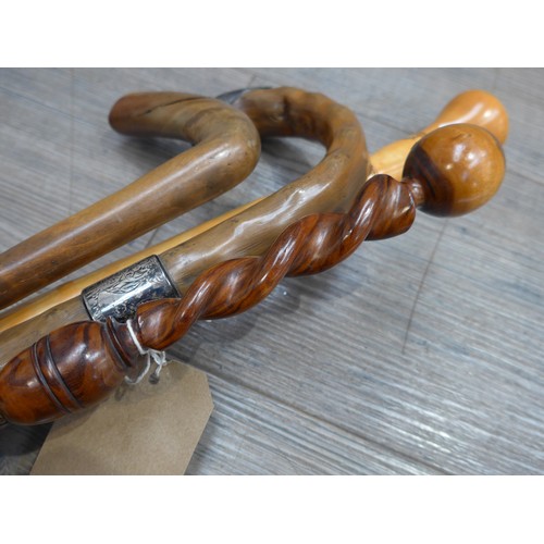 8612 - Four walking sticks/canes including walnut twist handle example