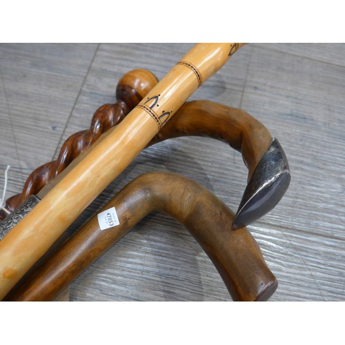 8612 - Four walking sticks/canes including walnut twist handle example