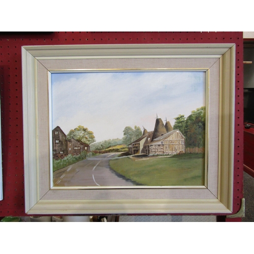 1067 - A framed oil on board, Oast House scene. Indistinctly signed bottom right. Image size 29cm x 39cm