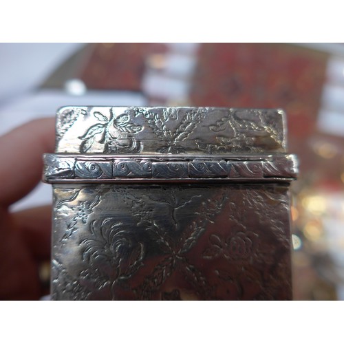 8091 - A George II Edward Wakelin silver lockable tea caddy of rectangular form with all-over lozenge patte... 