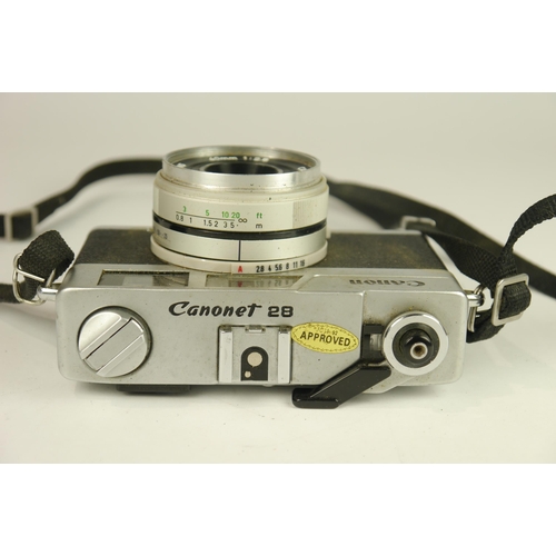 6034 - A Cased Canon Canonet 28 35mm film camera w/Canon Inc F2.8 40mm lens