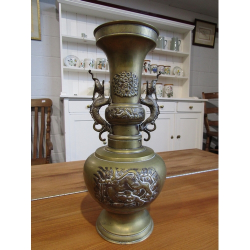 1002 - An Oriental twin handled brass vase. 35.5cm height