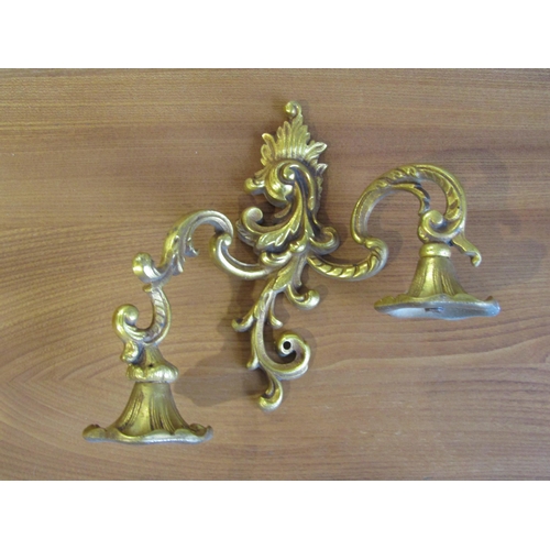 1004 - A pair of late 19th/early 20th Century French wall sconces, Louis XV style in cast brass, 19cm tall