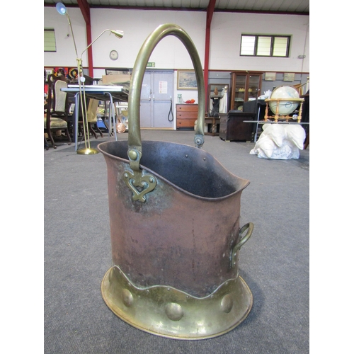 1005 - An Art Nouveau brass and steel coal scuttle, repair to base