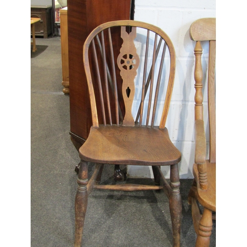 1020 - A low pine farmhouse kitchen chair and a wheel back chair (2)