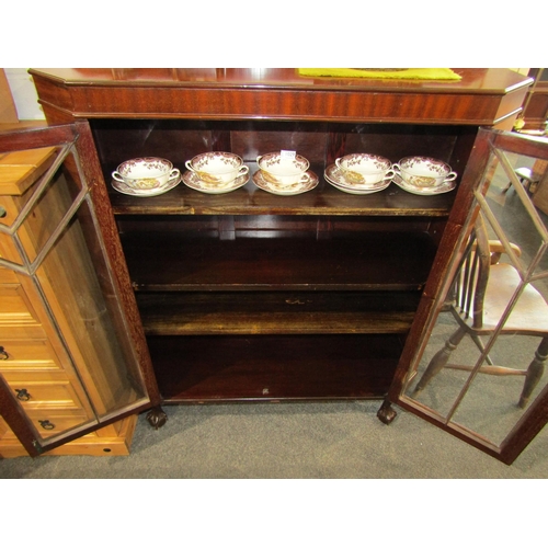 1028 - An early 20th Century mahogany display cabinet on ball in claw feet with key, 125cm tall x 102cm wid... 