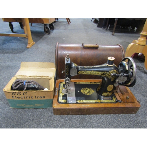 1064 - A Singer sewing machine, together with a G.E.C. electric iron