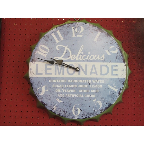 1065 - A novelty metal wall clock in the form of a botte cap advertising 