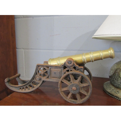 1091 - A pair of 19th Century miniature brass cannons on iron bases, 21cm tall x 45cm long