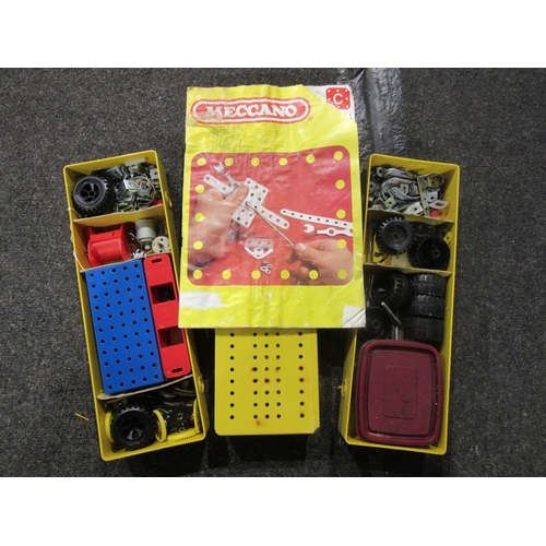 1433 - A selection of Meccano; three tins with contents and build booklet, A/F