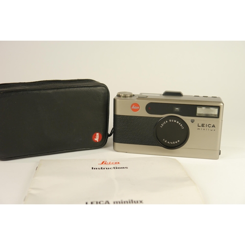 6078 - A cased Leica Minilux Summarit Titanium compact 35mm film camera w/ f2.4 40mm lens & Instructions