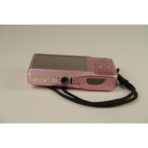 6069 - A Canon IXUS 105 12.1 Mega Pixel Digital Camera in Pink w/charger and manual 
**Untested**