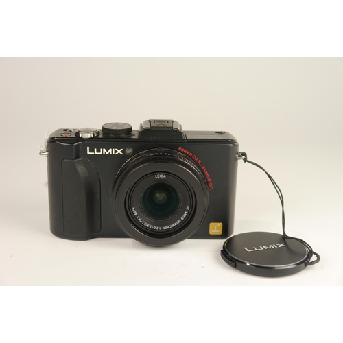 6099 - A cased Panasonic Lumix DMC-LX5 10MP Compact Digital Camera w/ Panasonic DE-A82 battery charger
**Un... 