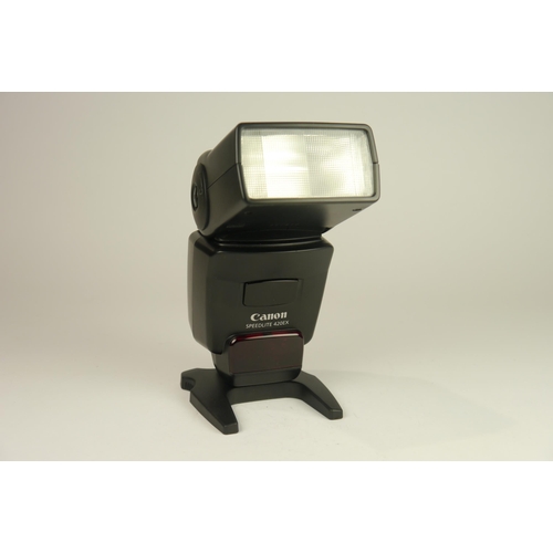 6058 - Two Canon SpeedLite Flashes, 420 EX & 580EX II. Both come with base holder brackets and cases