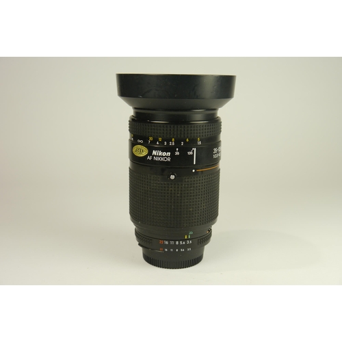 6097 - A Boxed Nikon D7000 DSLR Camera w/
Nikon AF-S DX Nikkor 18-200mm F3.5-5.6g ED VR 
Nikon Af Nikkor 75... 