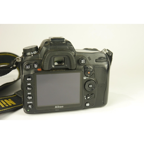 6097 - A Boxed Nikon D7000 DSLR Camera w/
Nikon AF-S DX Nikkor 18-200mm F3.5-5.6g ED VR 
Nikon Af Nikkor 75... 