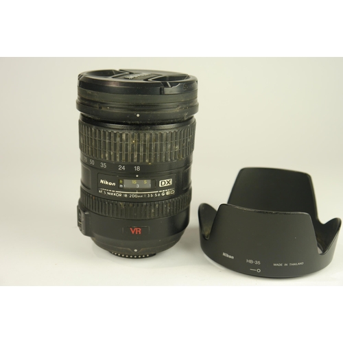 6097 - A Boxed Nikon D7000 DSLR Camera w/
Nikon AF-S DX Nikkor 18-200mm F3.5-5.6g ED VR 
Nikon Af Nikkor 75... 