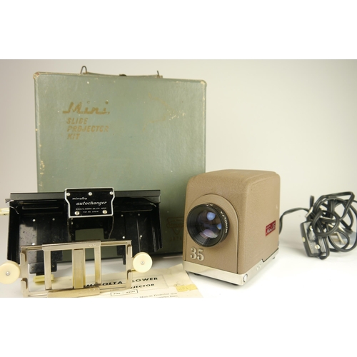 6091 - A cased Minolta mini 35 slide projector with blower & a Minolta slide autochanger