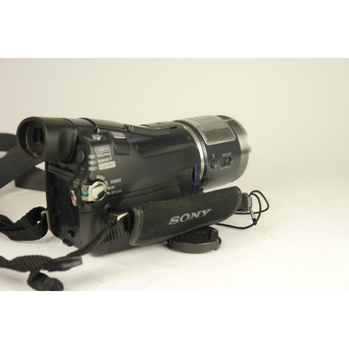 6065 - A Cased Sony HDR-HC1E Mini DV 1080i video camcorder w/ Two Sony conversions lens, Three battery's an... 