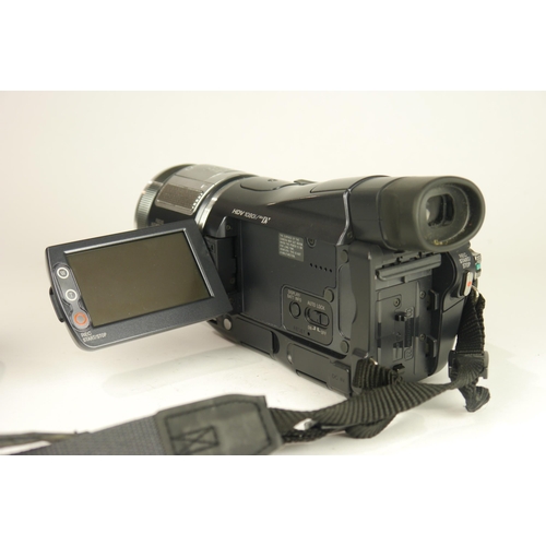 6065 - A Cased Sony HDR-HC1E Mini DV 1080i video camcorder w/ Two Sony conversions lens, Three battery's an... 