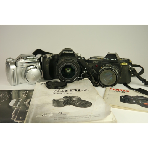 6088 - A Pentax ist D L2 DSLR camera w/ SMC Pentax DA 18-55mm f3.5-5.6 AL lens and manual. A Pentax P50 SLR... 