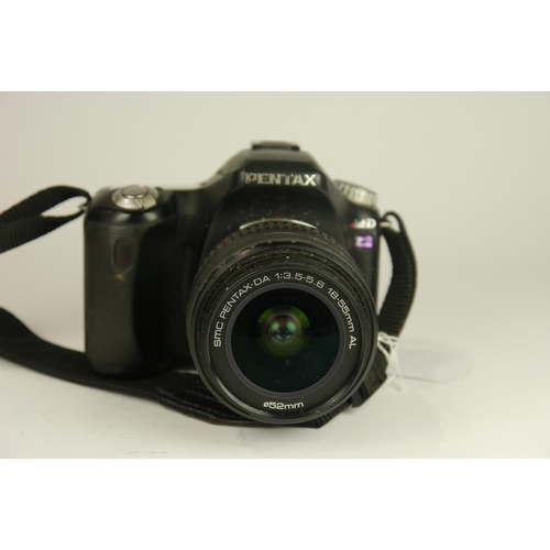 6088 - A Pentax ist D L2 DSLR camera w/ SMC Pentax DA 18-55mm f3.5-5.6 AL lens and manual. A Pentax P50 SLR... 