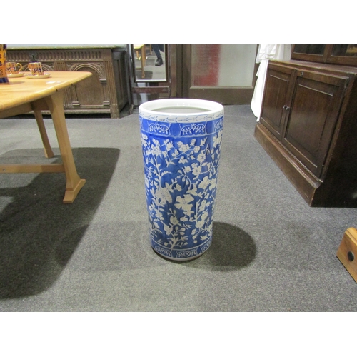 1039 - A Chinese style blue and white cylindrical umbrella and stick stand, together with a similar table l... 