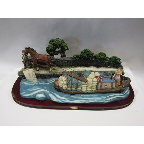 1403 - A Juliana Collection resin figural group of narrow boat being pulled by horse, 48cm long