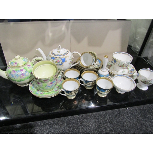 1404 - A set of six Noritake turquoise-banded and gilt coffee cups and saucers. A Foley 