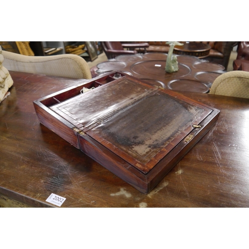 2004 - A 19th Century rosewood writing box with leather slope, key and inkwell