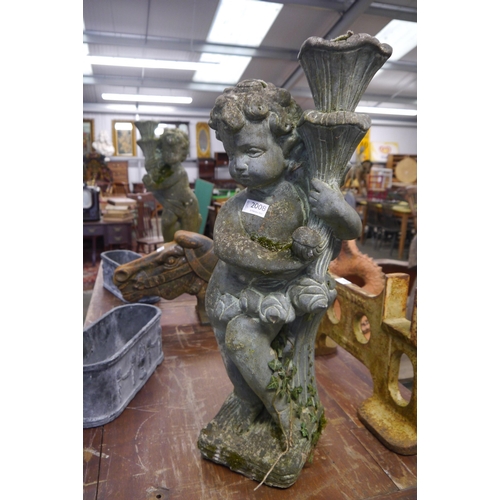 2008 - A pair of composition torch holding cherub patio lamp bases