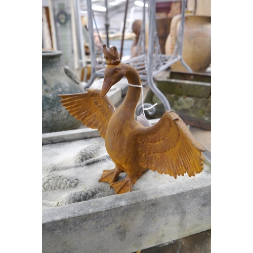 2036 - A cast iron swan with crown figure