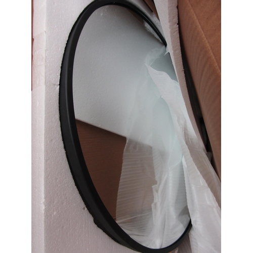 2429 - A black framed round mirror, 90cm wide, shop return