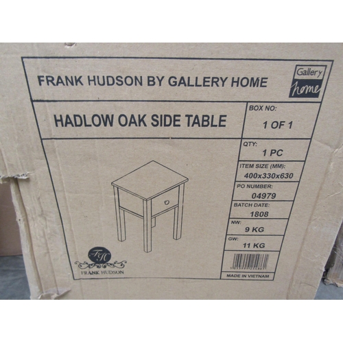 2435 - An oak side table, shop return