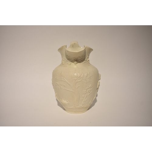 4313 - A Victorian Parian ware classical jug, the body decorated with grape and vine, 21cm tall