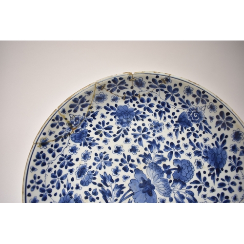 4318 - A late 18th/early 19th Century Chinese blue & white bowl with rivet repairs, all over flower and lea... 